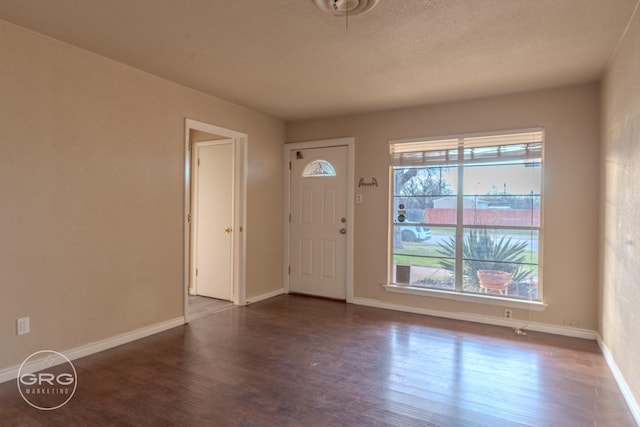 foyer entrance with dark hardwood / wood-style flooring