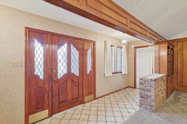 entryway featuring vaulted ceiling