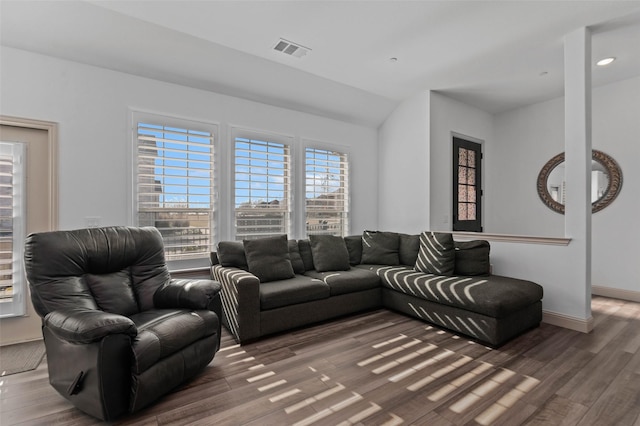 living room with vaulted ceiling and dark hardwood / wood-style floors