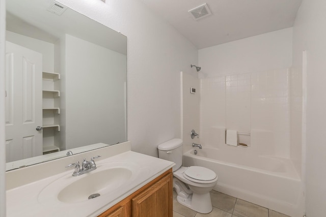 full bathroom with toilet, vanity, tile patterned floors, and shower / bathtub combination