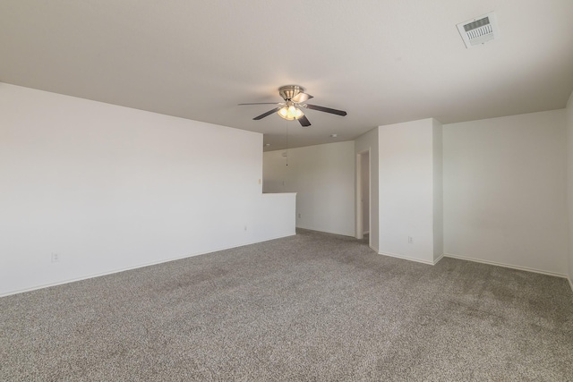 spare room with ceiling fan and carpet floors