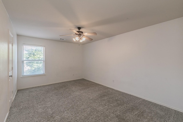 carpeted empty room featuring ceiling fan