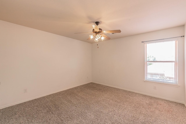 empty room featuring ceiling fan and carpet floors