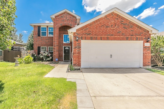 view of front property featuring a front lawn and a garage