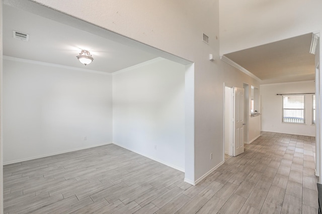 spare room featuring ornamental molding