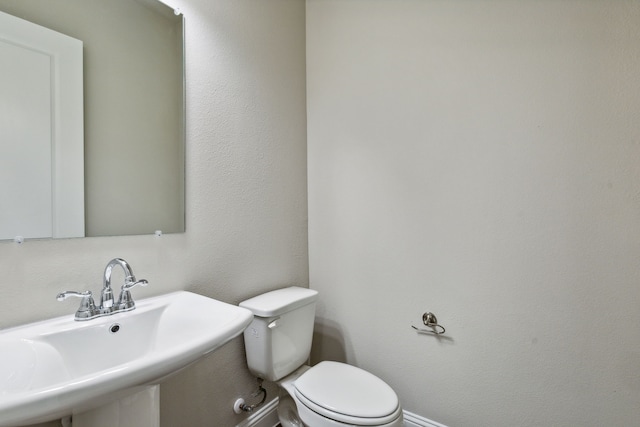 bathroom with toilet and sink