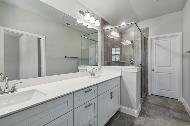 bathroom featuring vanity and a shower with door