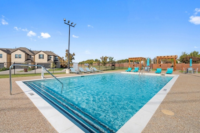 view of swimming pool with a pergola and a patio area