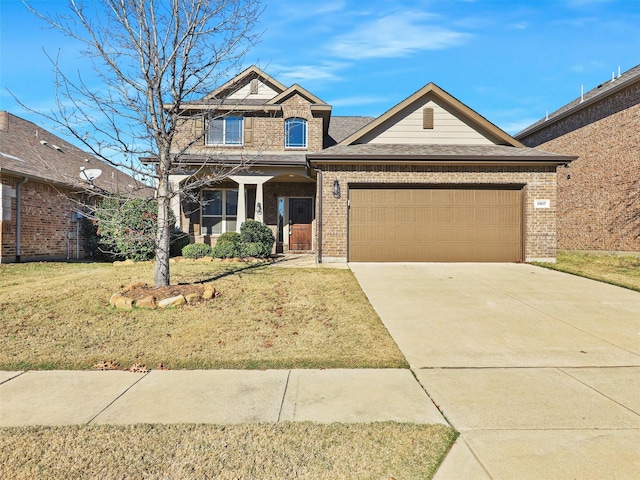 craftsman house featuring a garage and a front yard