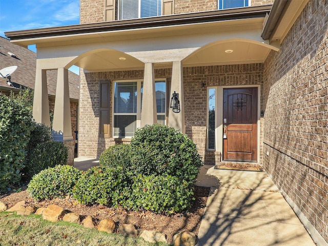 doorway to property featuring a porch