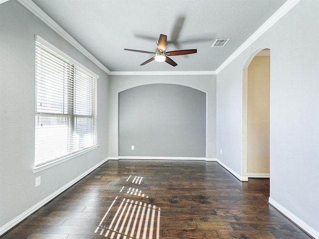 empty room featuring ceiling fan, dark hardwood / wood-style flooring, and ornamental molding