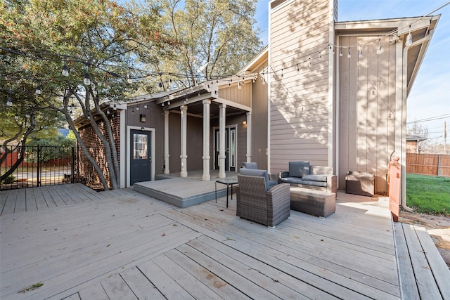 wooden deck featuring an outdoor living space