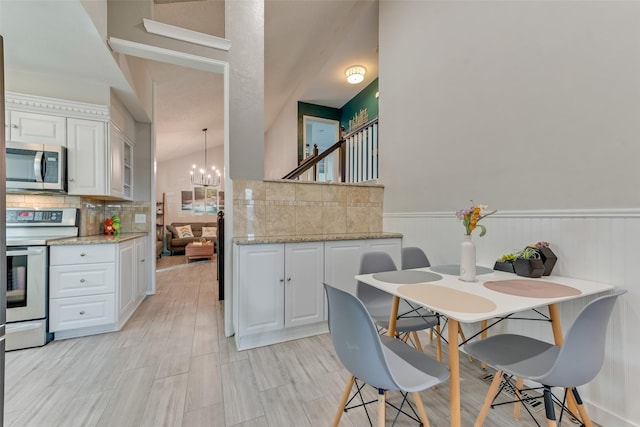 dining room featuring a chandelier