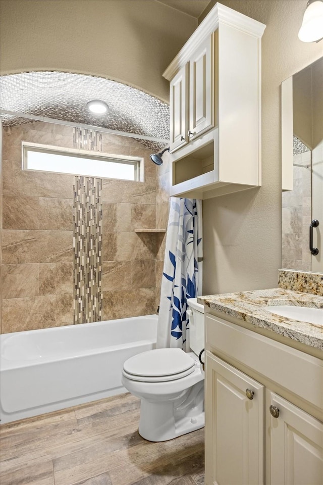 full bathroom featuring hardwood / wood-style floors, shower / bath combination with curtain, toilet, and a wealth of natural light