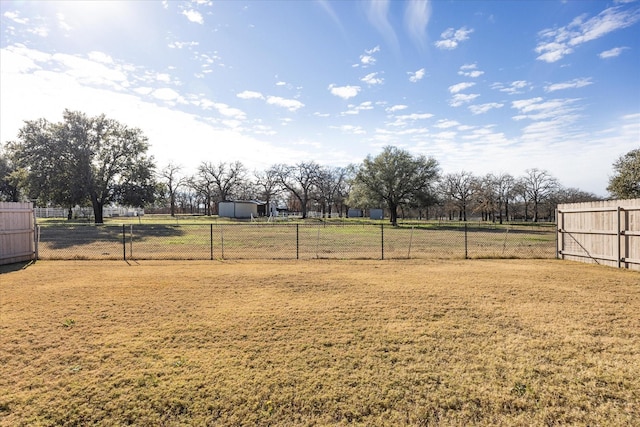 view of yard with a rural view