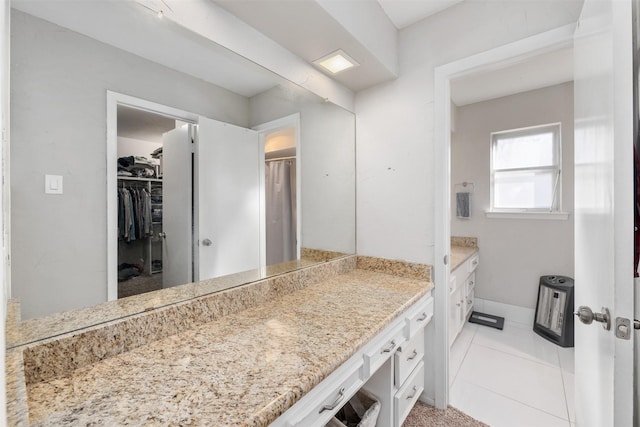 bathroom with tile patterned floors and vanity