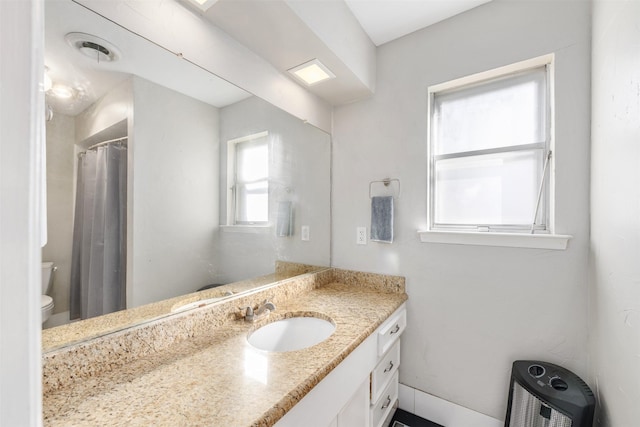 bathroom with vanity and toilet