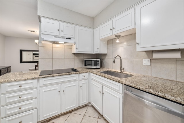 kitchen with white cabinets, sink, appliances with stainless steel finishes, and tasteful backsplash