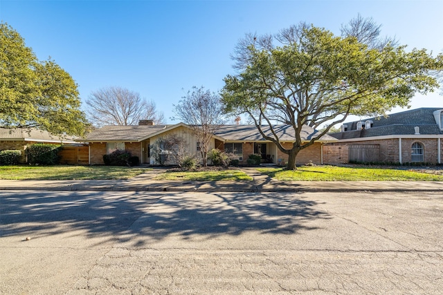 ranch-style house with a front yard