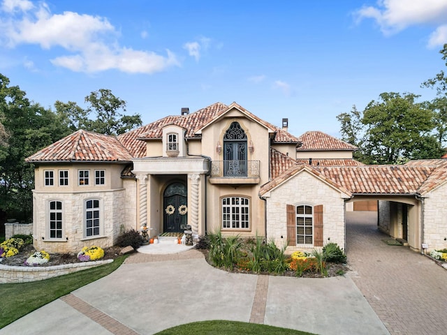 mediterranean / spanish home featuring a balcony