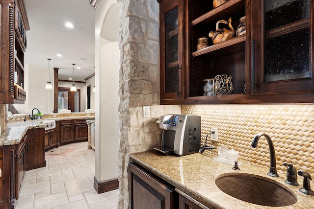 bathroom featuring tasteful backsplash, crown molding, and vanity