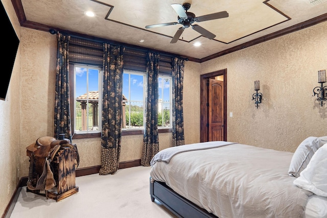 bedroom featuring ceiling fan, crown molding, and carpet