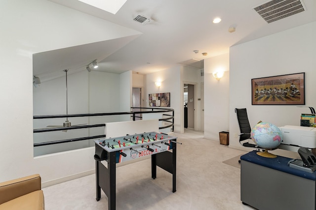 playroom featuring light carpet and vaulted ceiling