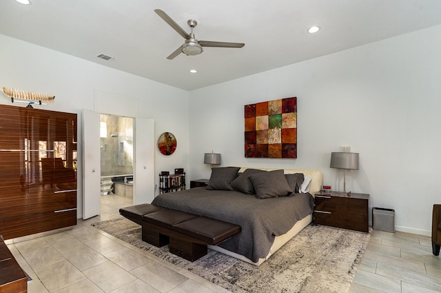 bedroom with ensuite bathroom, ceiling fan, and light tile patterned floors