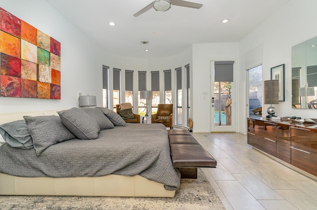 bedroom with multiple windows, ceiling fan, light tile patterned floors, and access to exterior