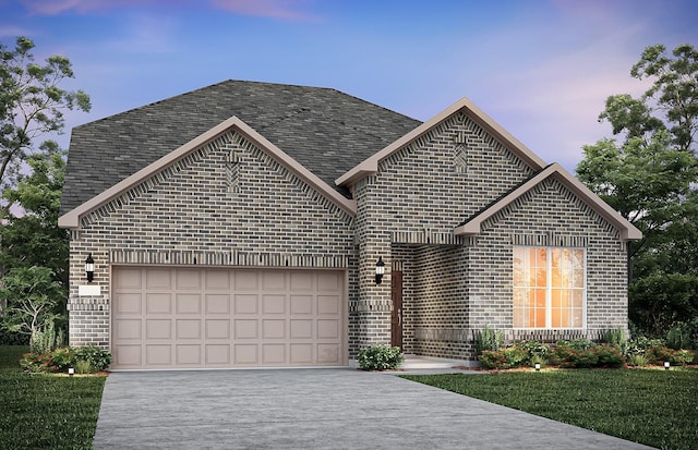 view of front property with a garage and a lawn