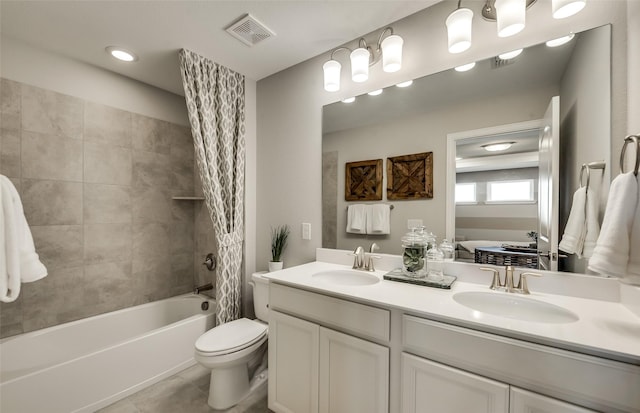 full bathroom with tile patterned flooring, vanity, toilet, and tiled shower / bath