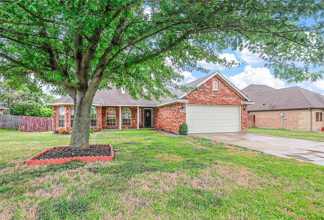 view of front of home with a garage and a front yard