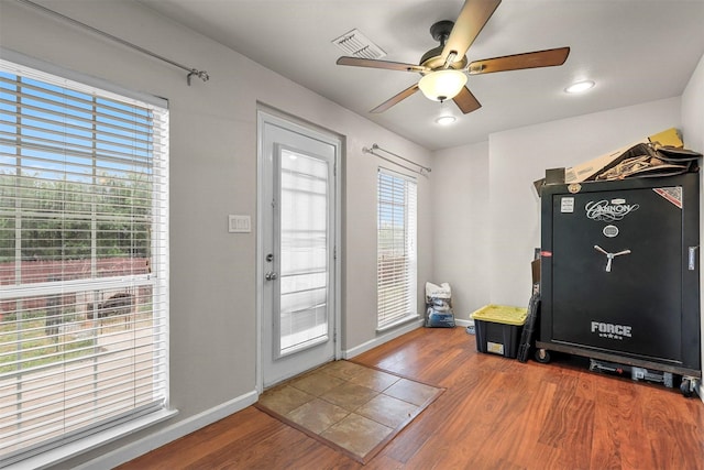 interior space featuring ceiling fan and wood-type flooring