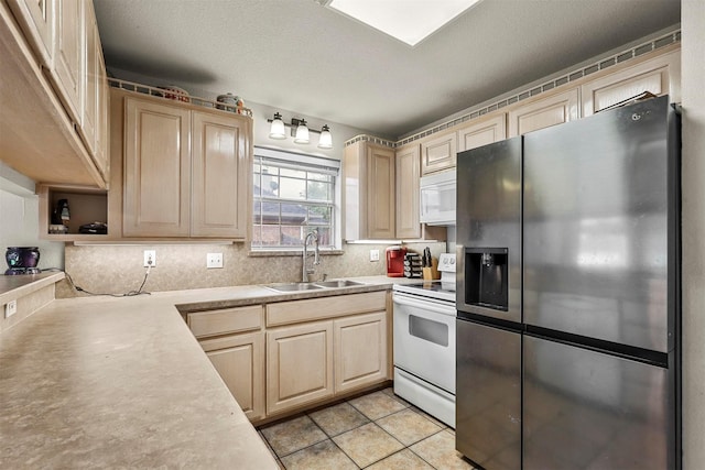 kitchen with light brown cabinetry, sink, decorative backsplash, light tile patterned floors, and white appliances