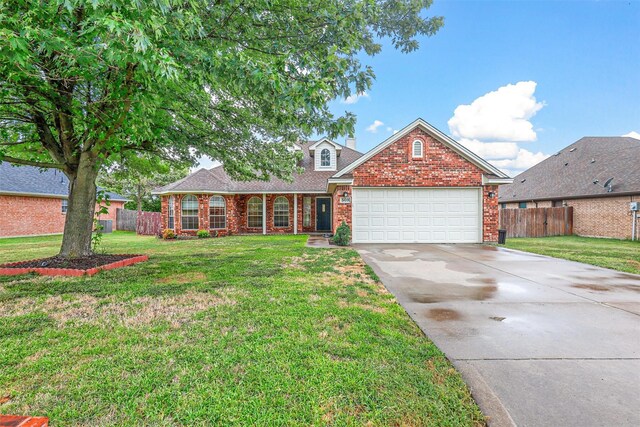 view of front property featuring a front lawn and a garage