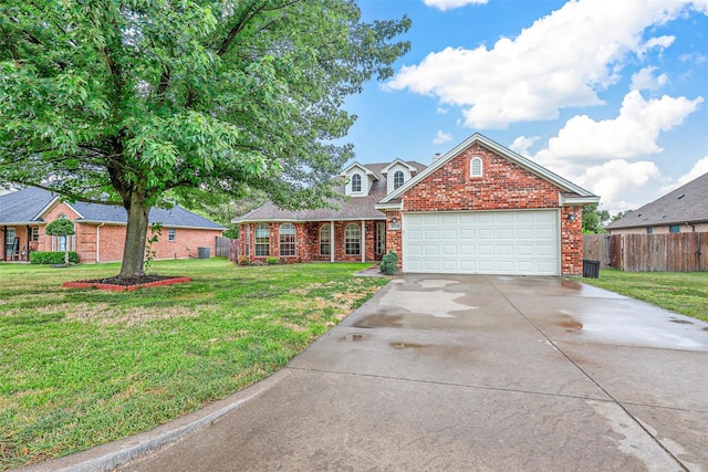 view of front of house featuring a garage and a front yard