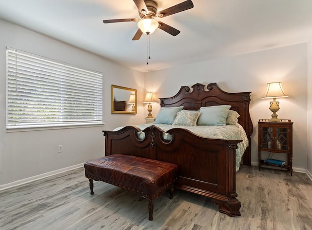 bedroom featuring ceiling fan, wood-type flooring, and pool table