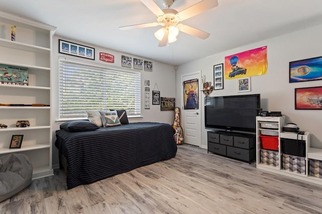 bedroom featuring light hardwood / wood-style floors and ceiling fan