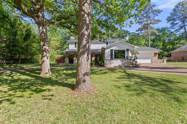 single story home with a front yard and a garage