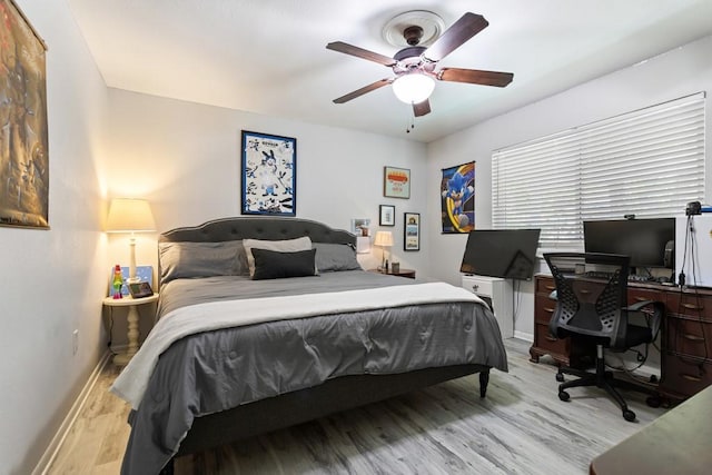 bedroom featuring light hardwood / wood-style floors and ceiling fan