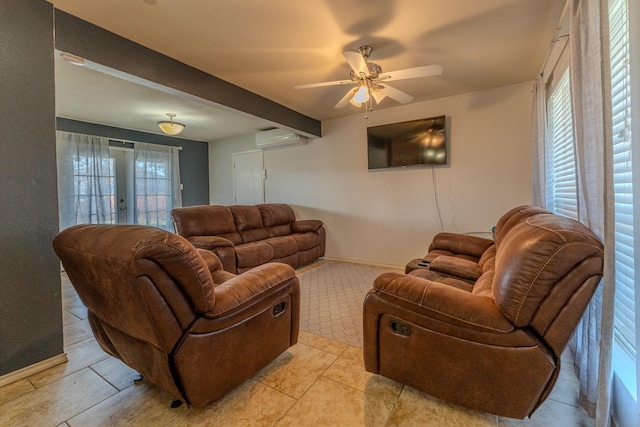 living room with an AC wall unit, ceiling fan, plenty of natural light, and light tile patterned flooring