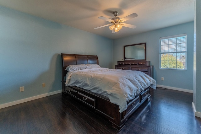 bedroom featuring dark hardwood / wood-style flooring and ceiling fan