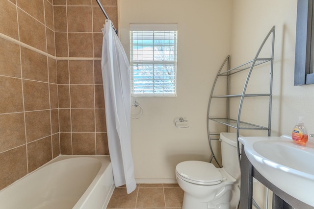 full bathroom with tile patterned floors, toilet, shower / bathtub combination with curtain, and sink