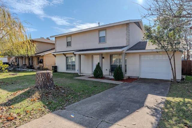 view of property featuring a front lawn and a garage