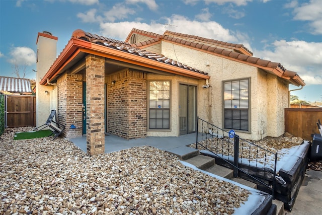 rear view of house featuring a patio area