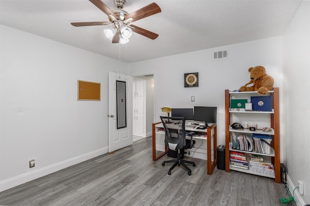 office with wood-type flooring, a textured ceiling, and ceiling fan