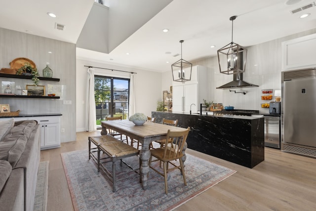 dining room featuring light hardwood / wood-style floors and sink