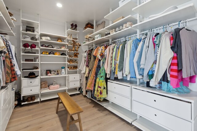 spacious closet with light hardwood / wood-style floors