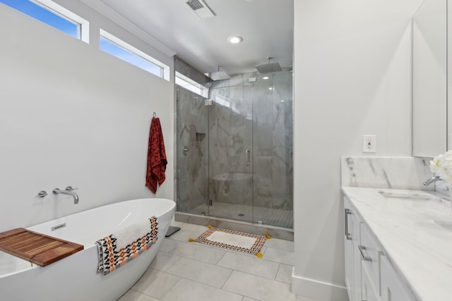 bathroom featuring vanity, tile patterned floors, and independent shower and bath