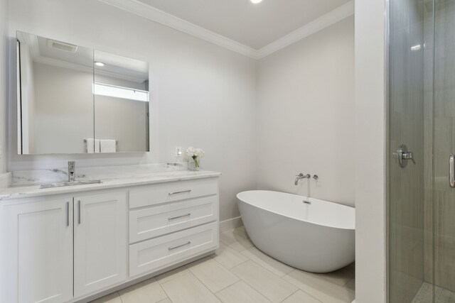 bathroom featuring tile patterned floors, vanity, ornamental molding, and shower with separate bathtub